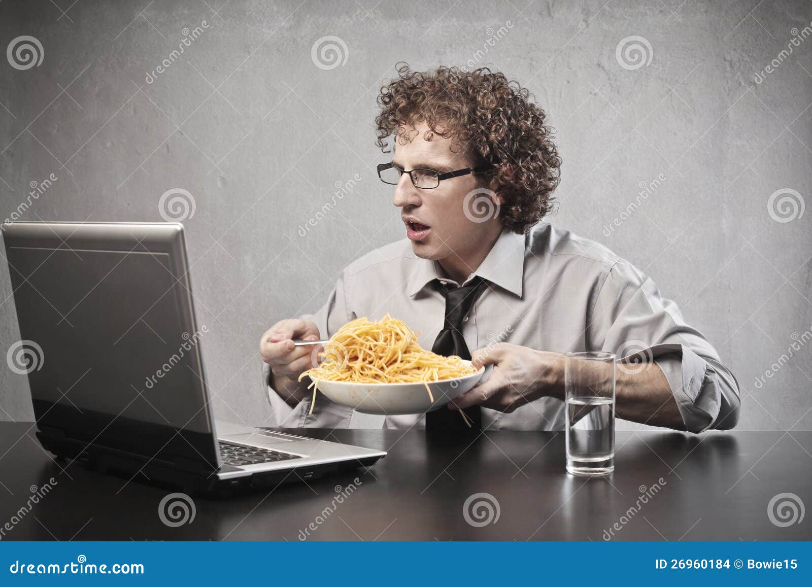 surprised-businessman-eating-26960184.jpg